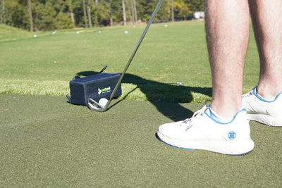 Golfer demonstrating over-the-top swing path that causes a slice